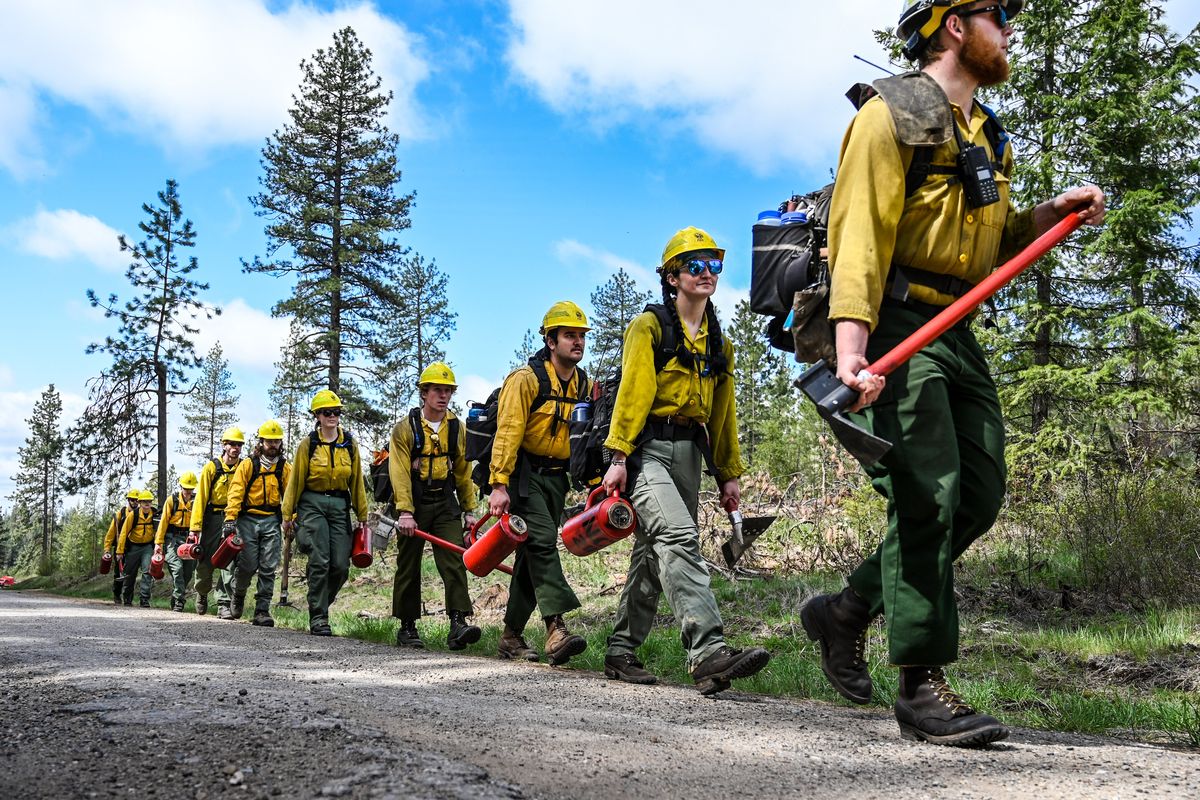 Department of Natural Resources firefighters from Colville head out Tuesday to do a 108-acre prescribed burn on a hillside near Springdale, Wash.  (COLIN MULVANY/THE SPOKESMAN-REVIEW)