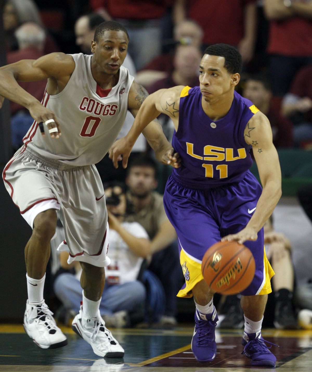 Washington’s State’s Marcus Capers, left, pressures LSU’s Bo Spencer during the first half.  (Associated Press)