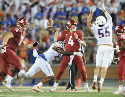 Washington State Cougars quarterback Luke Falk (4) is sacked by Boise State Broncos defensive end Jabril Frazier (8) and fumbles the ball which Boise State recovered for a touchdown during the second half of a college football game on Saturday, September 9, 2017, at Martin Stadium in Pullman, Wash. (Tyler Tjomsland / The Spokesman-Review)