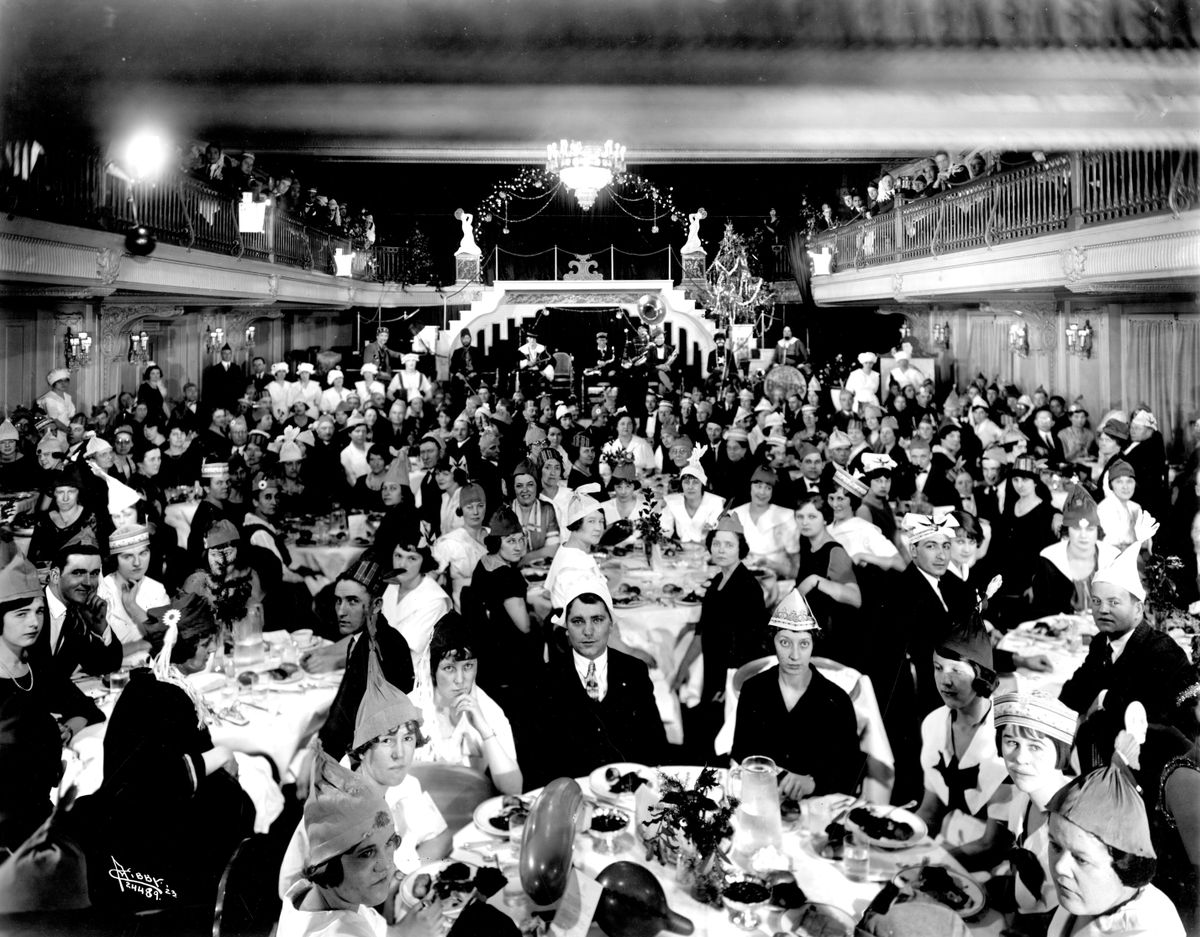 1923: In spite of the absence of alcohol, merrymakers pose for a group photo during a New Year’s Eve party in the Davenport Hotel’s Marie Antoinette Room in 1923. Entertainment that evening included dance revues and a “minstrel” dance band with at least one white musician in blackface makeup. By all accounts, proprietor Louis Davenport abided by the laws of Prohibition, but people still flocked to the Davenport for New Year’s Eve parties each year, even after the state of Washington enacted its own limited prohibition  on Jan. 1, 1916. (Libby Collection/Eastern Washington Historical Society / Libby Collection/Eastern Washington Historical Society)