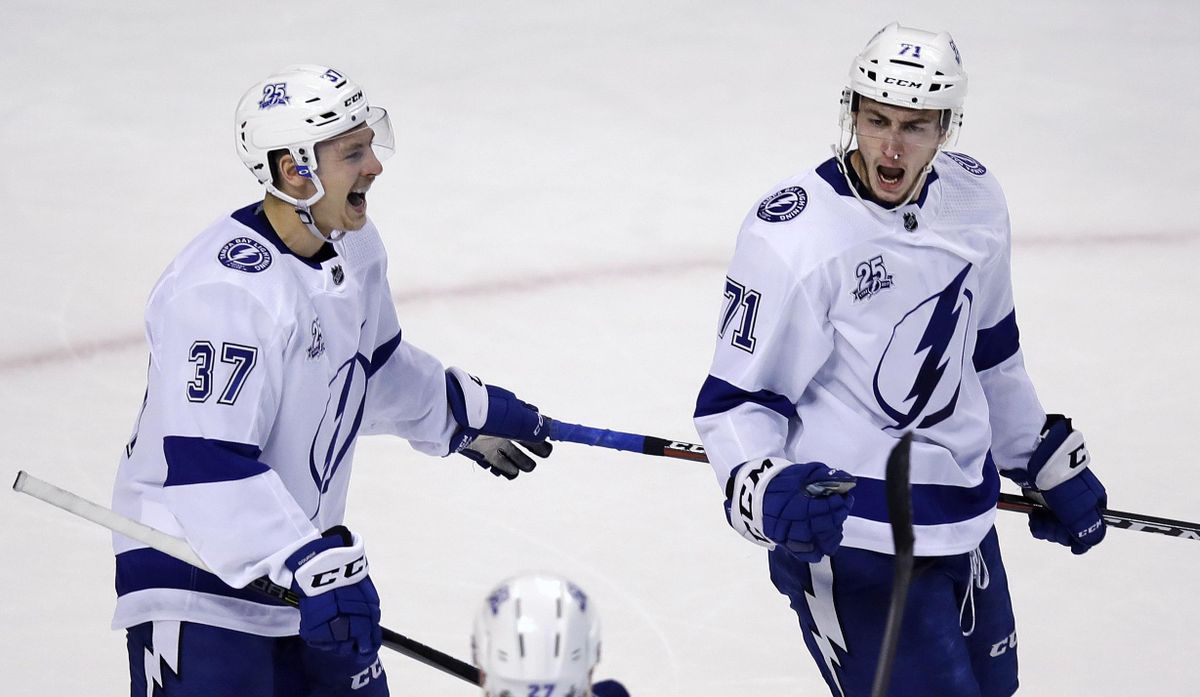 Tampa Bay Lightning center Anthony Cirelli, right, celebrates after his first-period goal off Boston Bruins goaltender Tuukka Rask during the first period of Game 3 of an NHL second-round hockey playoff series in Boston, Wednesday, May 2, 2018. At left is Lightning center Yanni Gourde, who got the assist. (Charles Krupa / Associated Press)