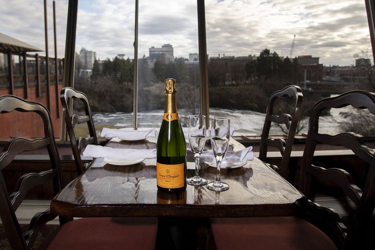 The dining tables with the Spokane River view are some of the most popular, shown Monday, Feb. 8, 2021, in Clinkerdagger, the upscale restaurant that has been in the historic Flour Mill since 1974. Reservations for the weekend, coinciding with Valentine’s Day, have been filling up at the restaurant. though capacity is limited to 25%.  (Jesse Tinsley/The Spokesman-Review)