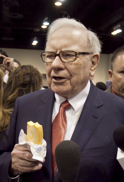 Warren Buffett holds an ice cream bar made by Berkshire-owned Dairy Queen in May 2011 prior to the shareholders meeting. (Associated Press)