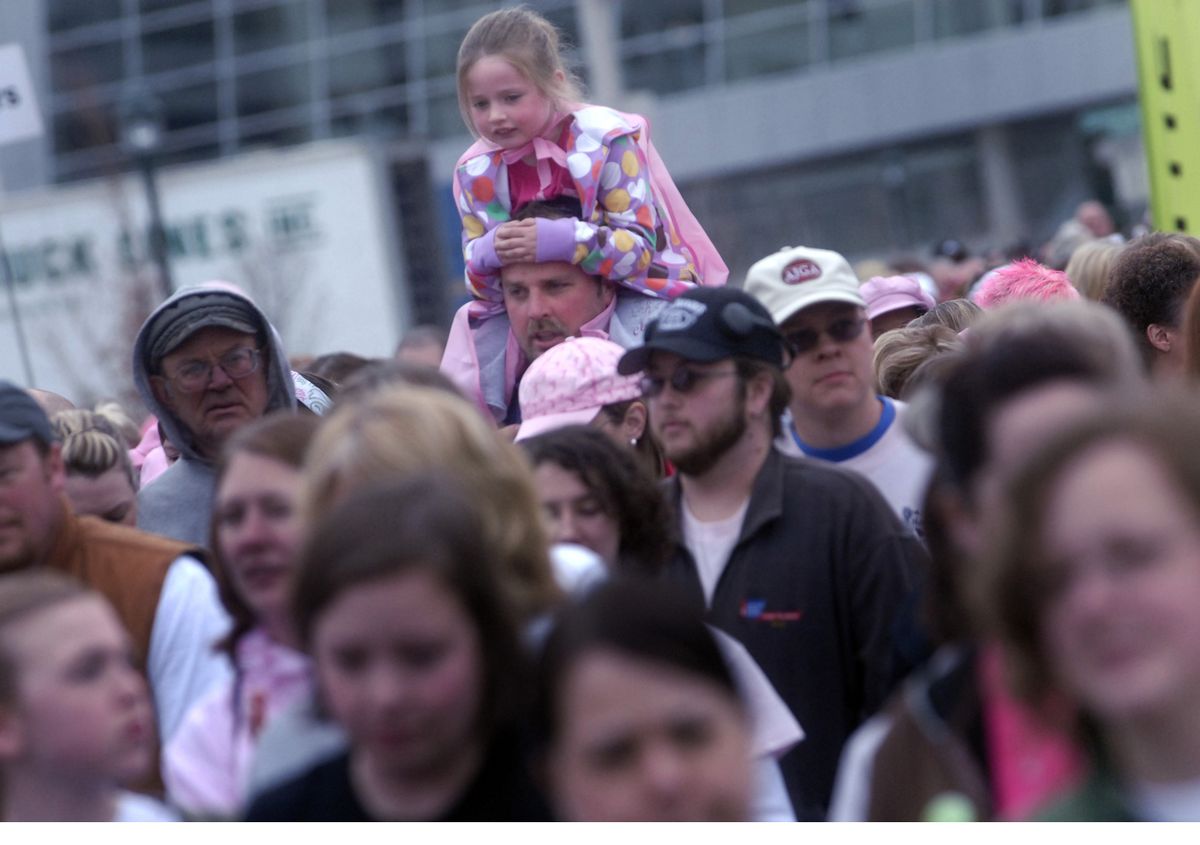 Steve Botter and his daughter  Abbi, 6, of Spokane,  walked in honor of Steve’s mother,  Margit,  a breast cancer survivor who also walked. (J. Rayniak / The Spokesman-Review)