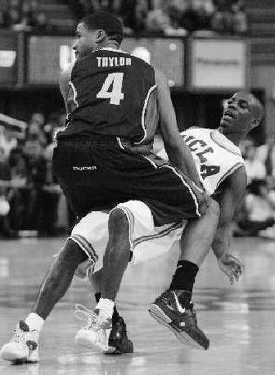 
UCLA's Darren Collison, right, watches his 3-point shot go in. 
 (Associated Press / The Spokesman-Review)