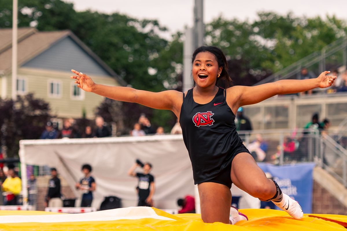 North Central’s Charlize Hall celebrates after clearing 12 feet, 9 inches to win the 3A girls pole vault on Friday at the WIAA State Track and Field Championships.  (Joshua Hart/For The Spokesman-Review)