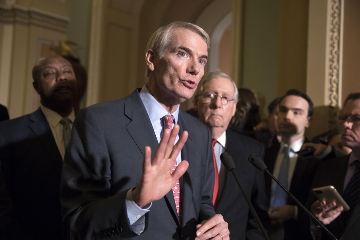 Sen. Rob Portman, R-Ohio, a member of the Senate Finance Committee, joins Sen. Tim Scott, R-S.C., left, and Majority Leader Mitch McConnell, R-Ky., to talk about work on overhauling the nation