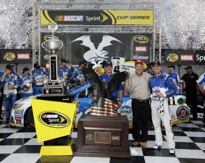 Kevin Harvick, right, celebrates after winning a NASCAR Sprint Cup Series auto race. (Wade Payne / Associated Press)