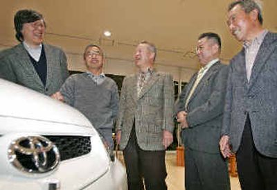 
Fumio Otsuka, left, a 54-year-old computer engineer, and other Toyota owners from left: Hiroshi Hayashizaki, Hirofumi Nakajima, Masatoshi Matsumaru, chat around Toyota's minivan Ipsum at Toyota's showroom in Tokyo last week. 
 (Associated Press / The Spokesman-Review)