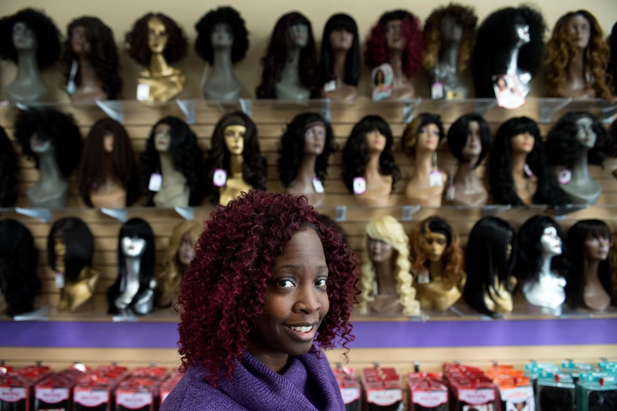 Shania Wright poses for a photo in WrightWay Beauty Supply, the store she owns with her husband, Michael Wright, on Tuesday, Feb. 20, 2018, at WrightWay Beauty Supply in Spokane. (Tyler Tjomsland / The Spokesman-Review)