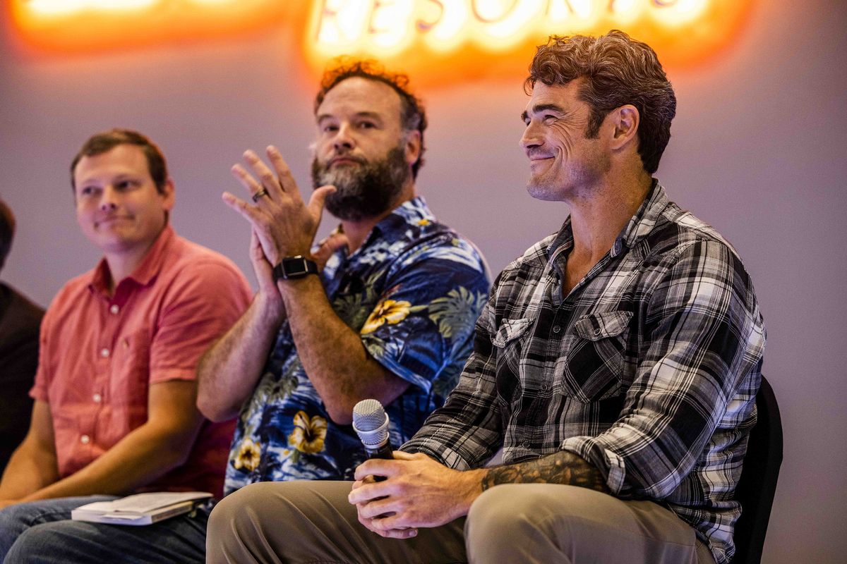 Joe Kent, right, smiles as he speaks on a panel with others at the RV Inn Style Resort Convention Center on Sept. 8, 2022. Kent is running against Marie Gluesenkamp Perez in a race in Washington's Third Congressional District.    (Daniel Kim/The Seattle Times/TNS)