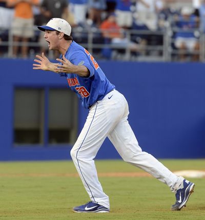 Florida pitcher Keenan Kish celebrates after defeating N.C. State in 10 innings to reach a third consecutive College World Series. (Associated Press)