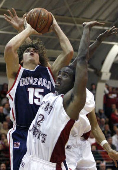 Gonzaga's Matt Bouldin shoots against Saint Joseph's Rob Ferguson in the second half. Associated Press
(Associated Press / The Spokesman-Review)