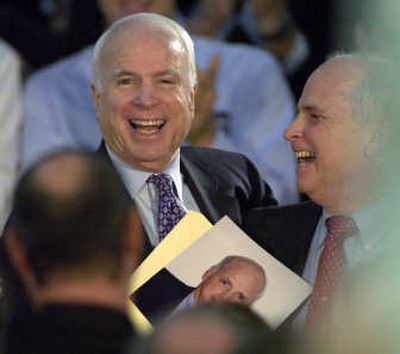 
Republican presidential hopeful Sen. John McCain shares a laugh with  supporter Jack Doyle,  who looks remarkably like McCain, while appearing at a town hall meeting at the Dom Umerley Civic Center in Rocky River, Ohio, Monday. Associated Press
 (Associated Press / The Spokesman-Review)