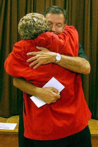 
 St. Susanna Parish Pastor Stephen Josoma receives a hug from parishioner Elaine Fitzpatrick at the church in Dedham, Mass., Tuesday after Josoma read a letter from Archbishop Sean O'Malley to confirm his church's closure.  St. Susanna Parish Pastor Stephen Josoma receives a hug from parishioner Elaine Fitzpatrick at the church in Dedham, Mass., Tuesday after Josoma read a letter from Archbishop Sean O'Malley to confirm his church's closure. 
 (Associated PressAssociated Press / The Spokesman-Review)