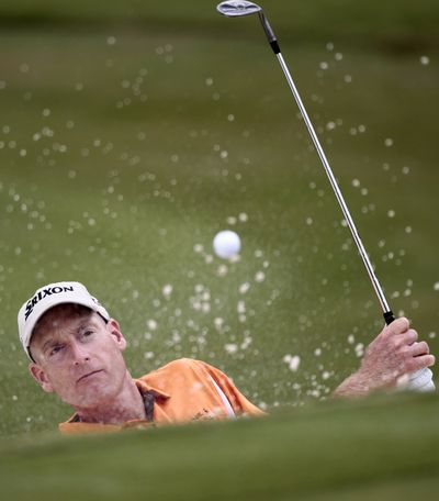 Jim Furyk, hitting from the sand on the seventh hole, can win the FedEx cup if he wins the Tour Championship this weekend. (Associated Press)