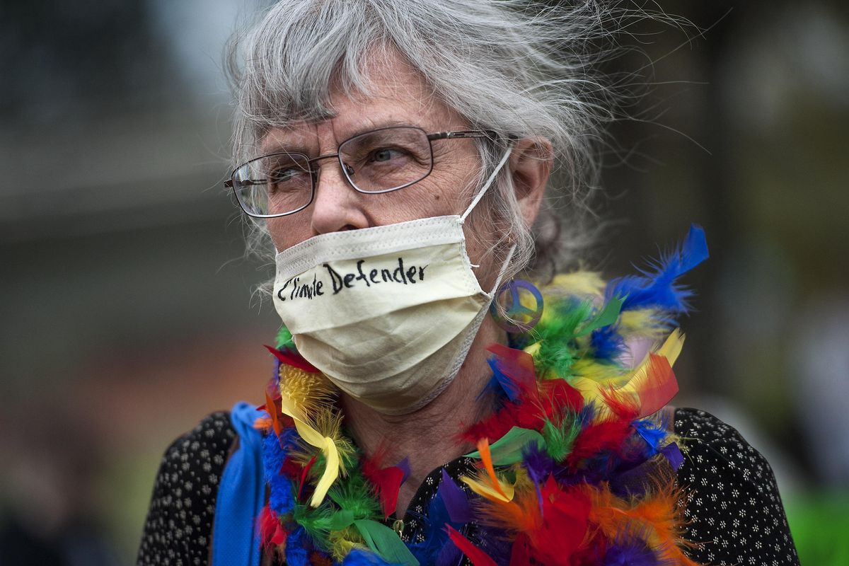 Mary Naber of the Raging Grannies walks through the crowd during the March for Science in Spokane on Saturday, April 22, 2017. (Kathy Plonka / The Spokesman-Review)