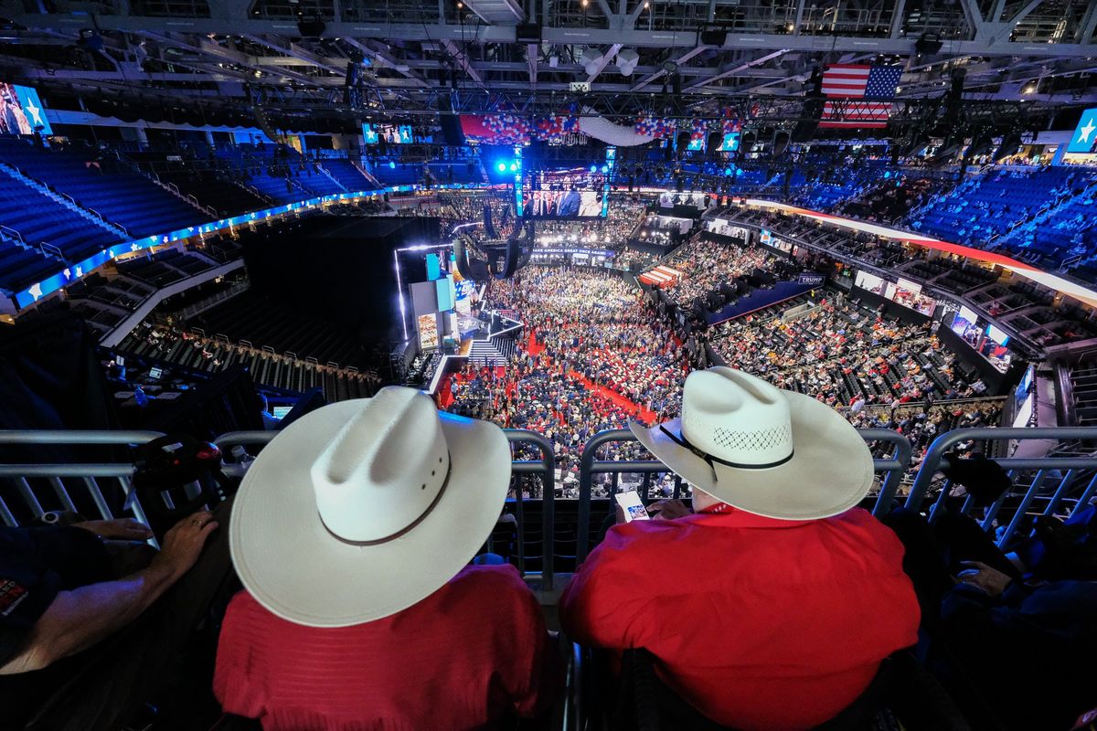 Two men listen to a speaker at the Republican National Convention in Milwaukee on Monday.  (Orion Donovan Smith/The Spokesman-Review)