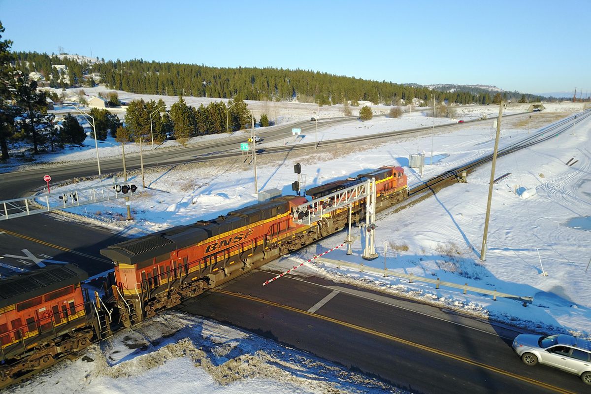 Traffic waits on Barker Road for an eastbound train near the corner of Barker Road and Trent Ave. Wednesday, Jan. 3, 2017. (Jesse Tinsley / The Spokesman-Review)