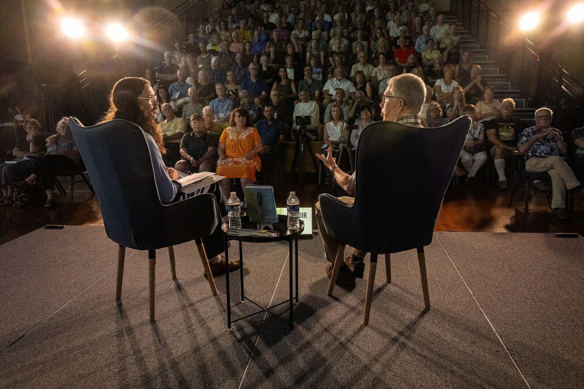 Author James Patrick Thomas, on right, in conversation with The Spokesman-Review reporter, Nick Gibson, talks about his book Atomic Pilgrim during a Northwest Passages event held, Tuesday, August 12, 2025, at the Gonzaga University - Myrtle Woldson Performing Arts Center - Recital Hall. Atomic Pilgrim is the story of how one person’s faith, actions, and persistence can impact seemingly immovable systems and hold even the most powerful bureaucracies to account. (COLIN MULVANY/THE SPOKESMAN-REVIEW)