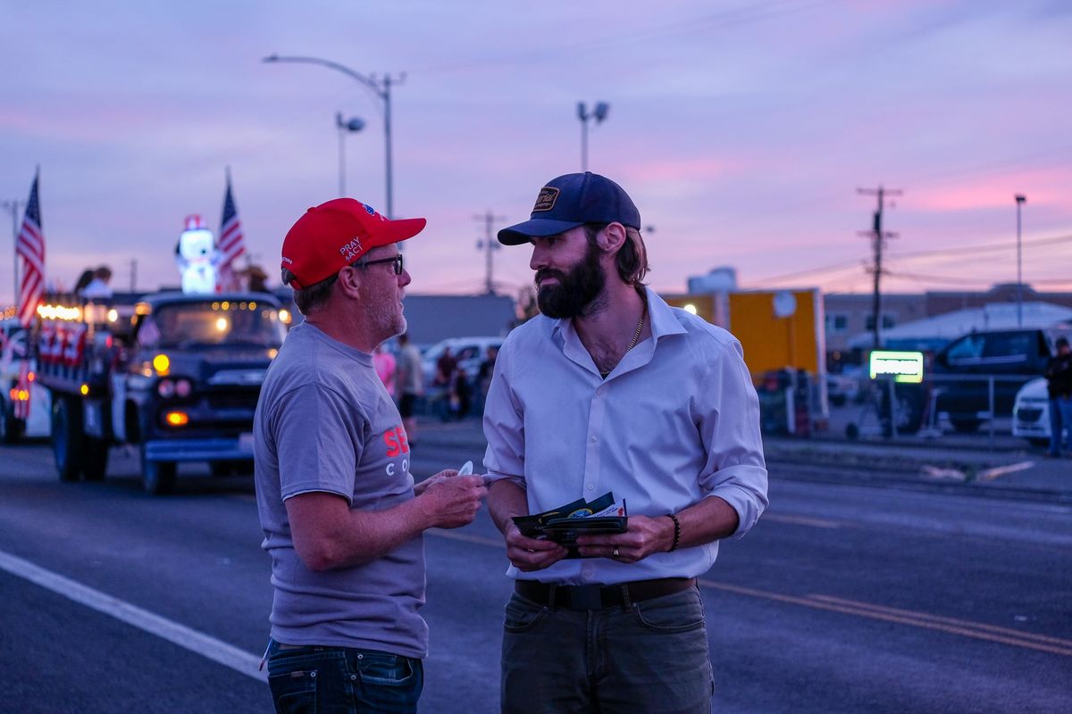 Republican Jerrod Sessler and Devin Pooré, a Cascade Party candidate, talk before the Spring Fest parade in Moses Lake, Wash., on May 23, 2026. Both men are running to represent Washington’s 4th Congressional District in the 2026 primary. (Orion Donovan Smith/The Spokesman-Review)