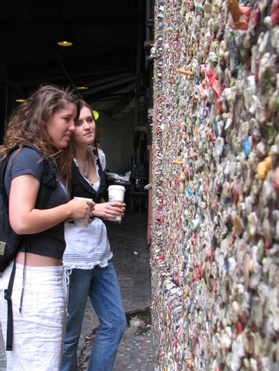 Pike Place Market Preservation & Development Authority estimates about 1 million pieces of gum are adhered to the walls of Post Alley, in some places 6 inches thick. (CHELSEA J. CARTER / File Associated Press)