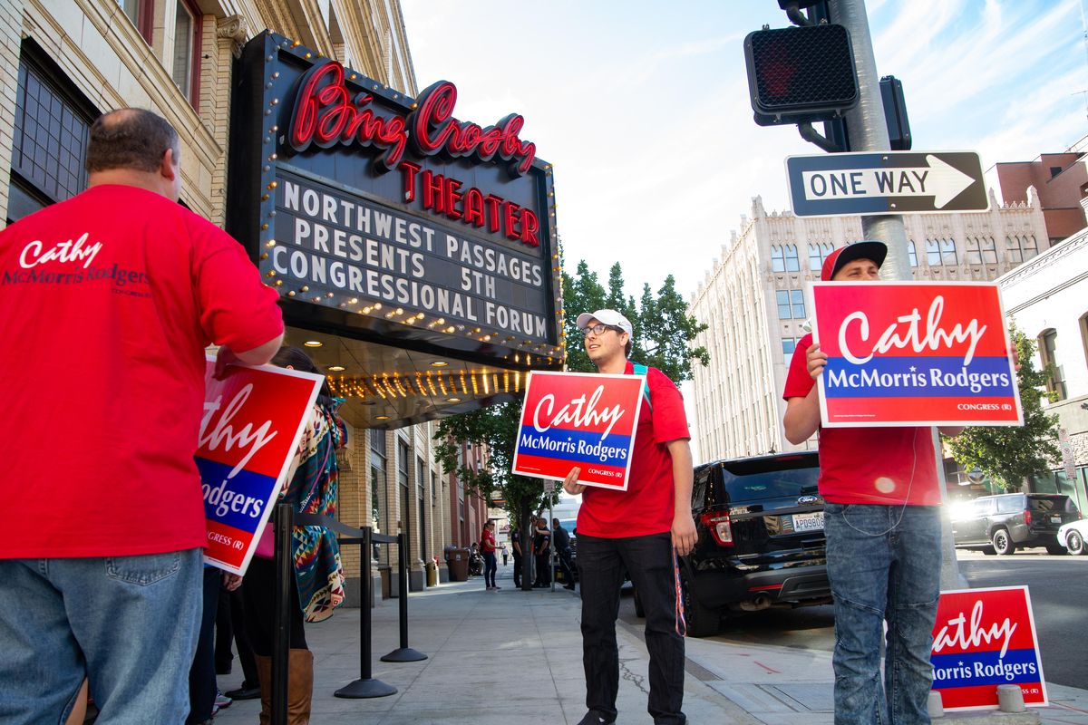 Brothers Louis and Anthony DiMauro show their support for Cathy McMorris Rodgers on Sept. 19 at the Bing Crosby Theater before a Northwest Passages Town Hall for 5th Congressional District candidates. The event was hosted by The Spokesman-Review and KHQ, and candidates fielded questions on healthcare, homelessness, veterans, gun control and more. (Libby Kamrowski / The Spokesman-Review)