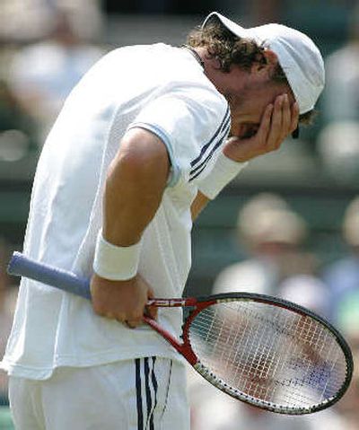 
Russia's Marat Safin reacts on his way to being defeated by Spain's Feliciano Lopez in their men's singles match on Friday.
 (Associated Press / The Spokesman-Review)