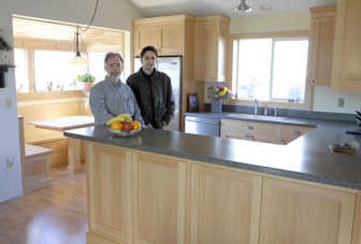 
Jon Gay, right, with Mark Hamilton, designed and made the cabinetry for the Hamiltons' Spokane Valley kitchen.
 (Photos by Bart Rayniak/ / The Spokesman-Review)