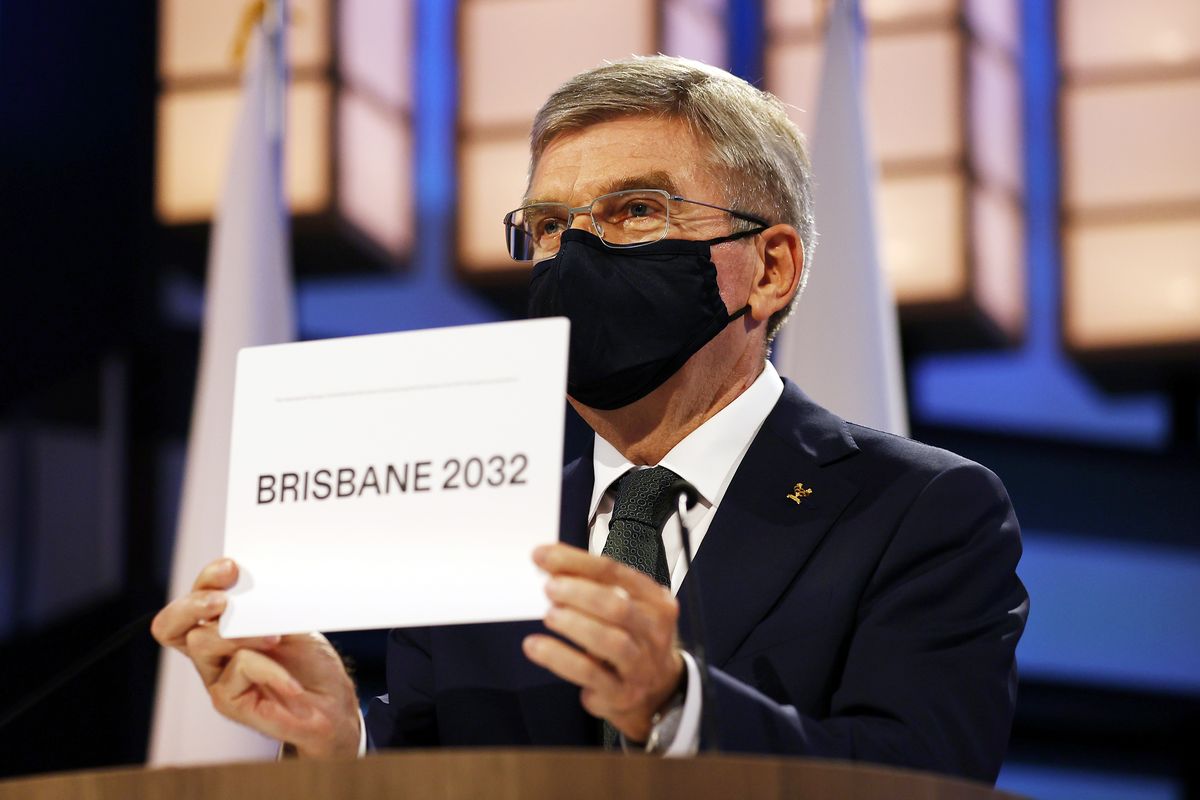 President of the International Olympic Committee Thomas Bach announces Brisbane as the 2032 Summer Olympics host city during the 138th IOC Session at Hotel Okura in Tokyo, Wednesday, July 21, 2021.  (Associated Press)