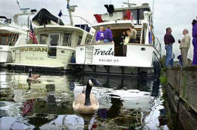 
Its wine and cheese time for Husky football fans as the big yachts tie up prior to a home football game. 
 (File/ / The Spokesman-Review)