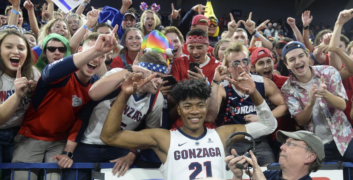 Gonzaga forward Rui Hachimura celebrates with Kennel Club members after beating Washington on Wednesday  in the McCarthey Athletic Center. (Dan Pelle / The Spokesman-Review)