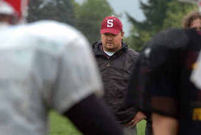 
First-year Sandpoint coach Sean Dorris, keeping a watchful eye on his offense during practice last week, inherits a team that lost the 2003 State 4A title game by two points. 
 (Jesse Tinsley / The Spokesman-Review)