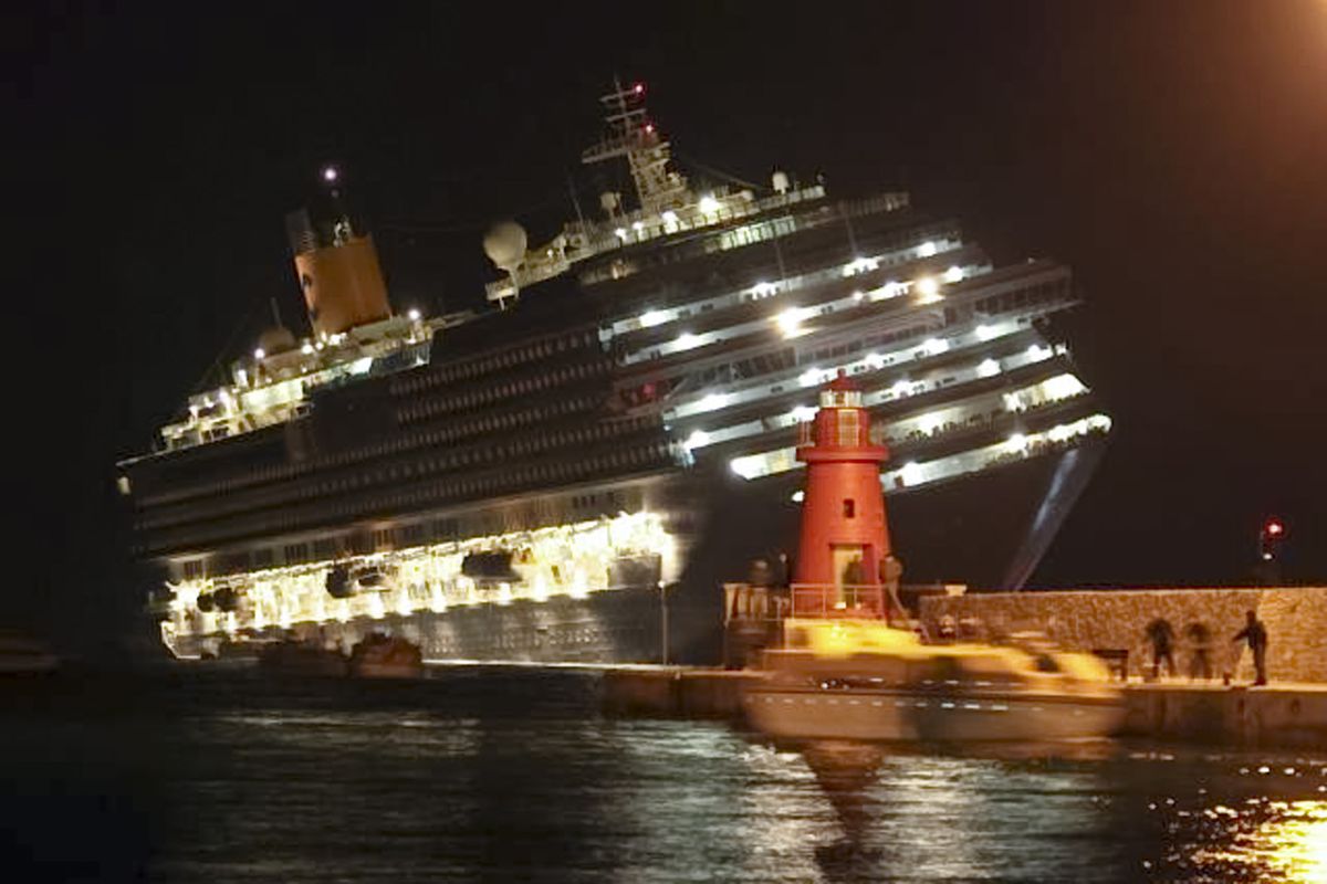 The luxury cruise ship Costa Concordia leans after it ran aground off the coast of Isola del Giglio island, Italy, gashing open the hull and forcing some 4,200 people aboard to evacuate aboard lifeboats to the nearby Isola del Giglio island, early Saturday, Jan. 14, 2012. About 1,000 Italian passengers were onboard, as well as more than 500 Germans, about 160 French and about 1,000 crew members. (Giorgio Fanciulli / Associated Press)