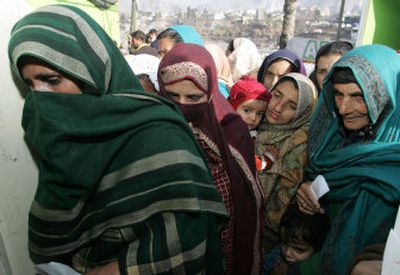 
Kashmiri women wait in a line to receive medical help for their children at a field hospital in Muzaffarabad, Pakistan, Saturday. 
 (Associated Press / The Spokesman-Review)