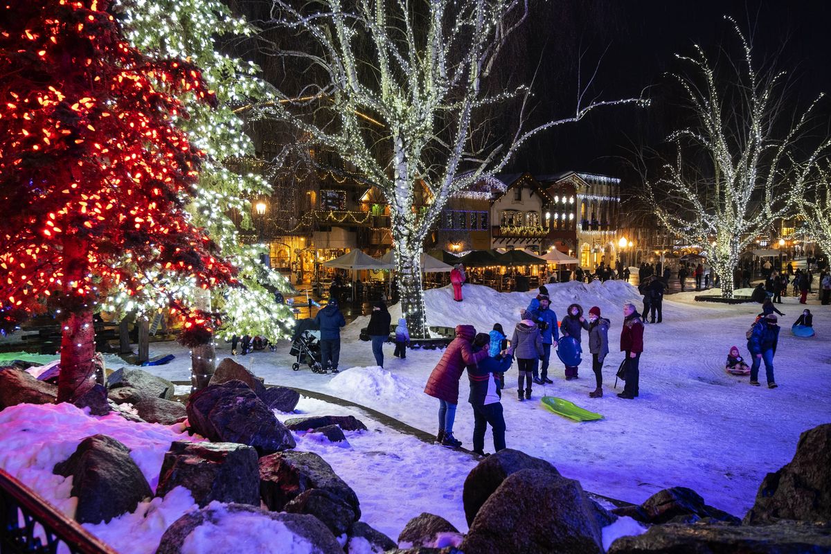 Despite having to cancel its Christmas Lighting Festival due to COVID-19, the city of Leavenworth will still have Christmas lights up until Valentine’s Day. This past weekend’s snow helped give Leavenworth a holiday glow that drew notable crowds to shop, dine, and recreate. Photographed Saturday, January 30, 2021.  (Dean Rutz/Seattle Times)