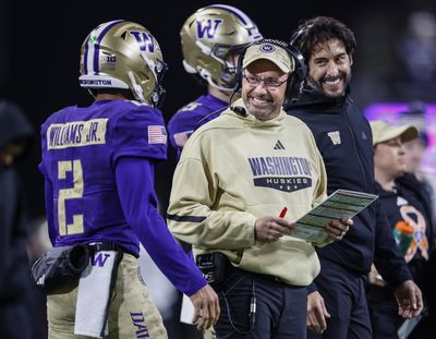 Washington head coach Jedd Fisch smiles at quarterback Demond Williams Jr. (2) as the Huskies get inside the Purdue 5-yard line late in the second quarter at Husky Stadium on Saturday, Nov. 15, 2025, in Seattle.   (Dean Rutz / Seattle Times)