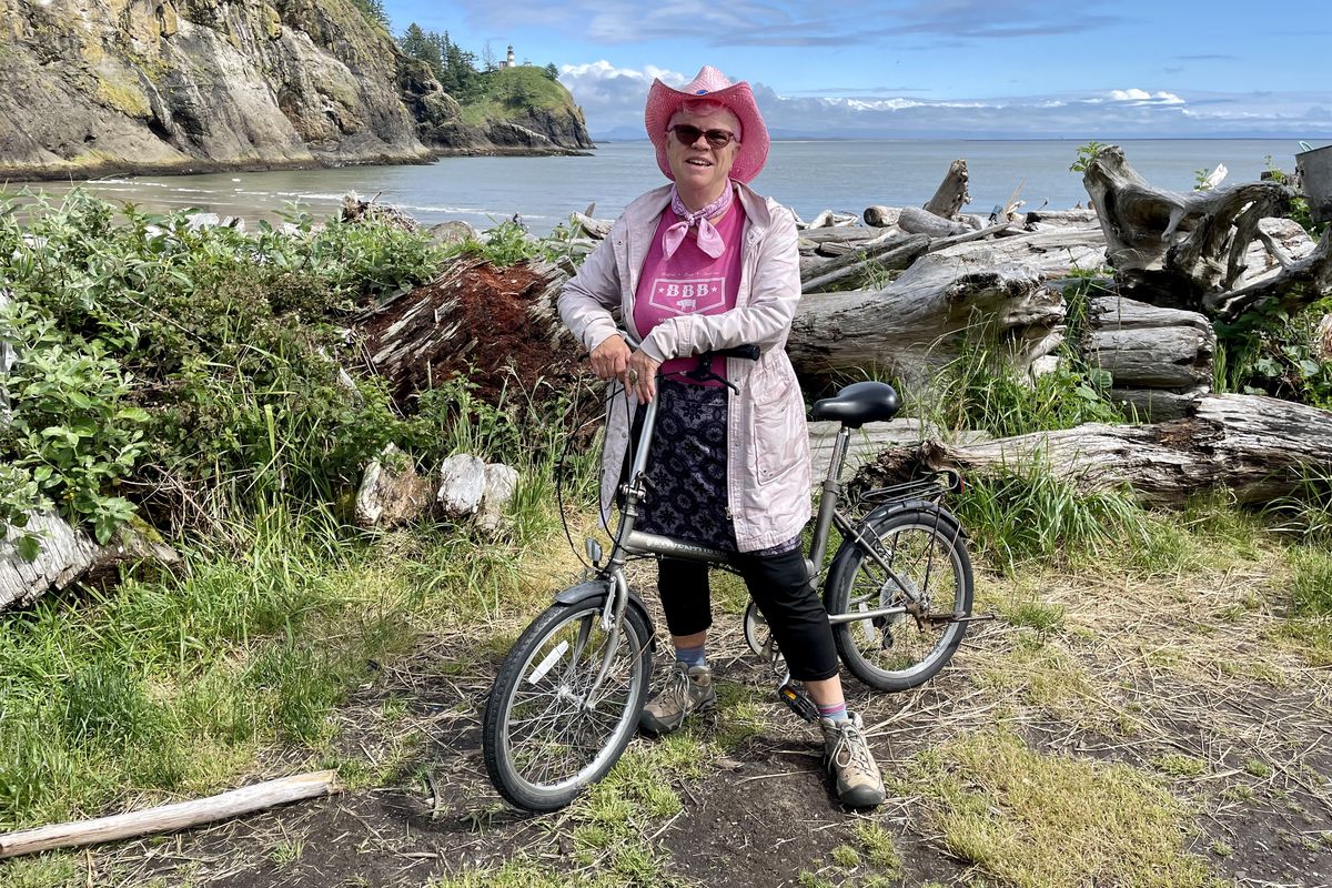 Leslie takes a bike ride near the Cape Disappointment light house. (John Nelson)