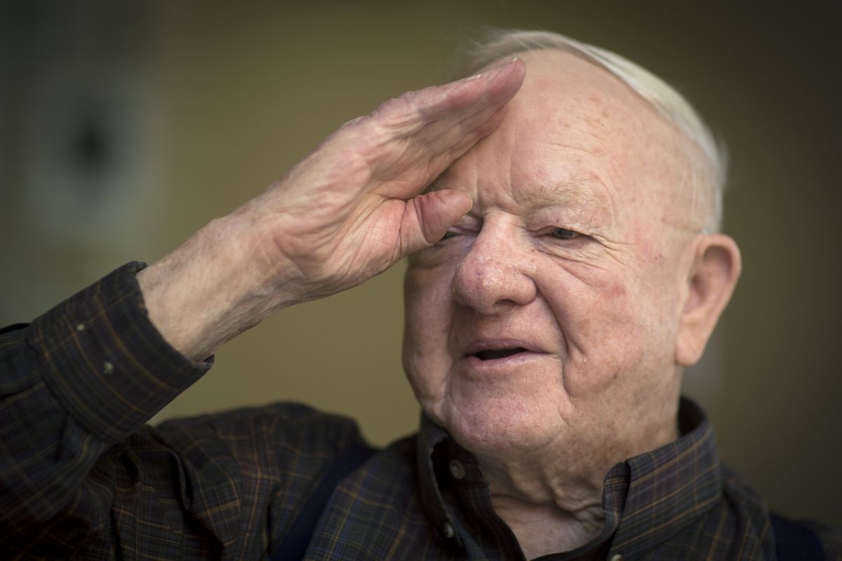 Seventy years ago, Ben Brooks landed in Normandy on D-Day. While telling a story about meeting U.S. Army Gen. Omar Bradley on the front lines, Brooks demonstrates the salute he gave the general while standing in his foxhole. (Colin Mulvany)
