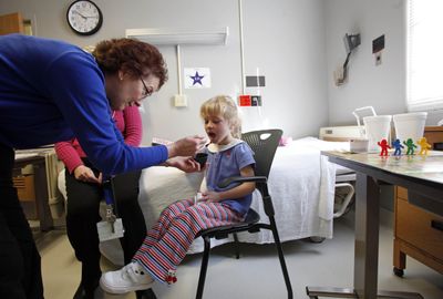 Hanna Carter, 5, of Roanoke, Va., takes a dosage of peanut protein from nurse practitioner Pam Steele at the Duke South Clinic  in Durham, N.C.  She  is being treated for peanut allergies.  (Associated Press / The Spokesman-Review)