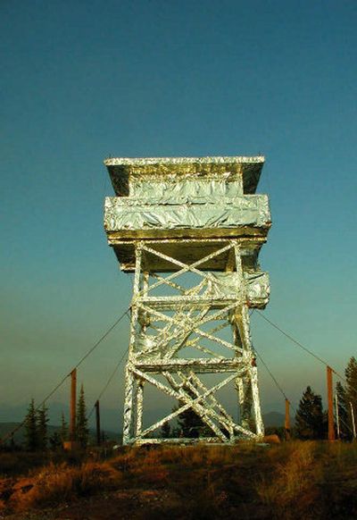 
The Gem Peak fire lookout tower along the Montana-Idaho border was wrapped with a fire-resistant material this week to protect the structure from advancing flames from the Ulm Peak Fire.
 (Photo courtesy of U.S. Forest Service / The Spokesman-Review)