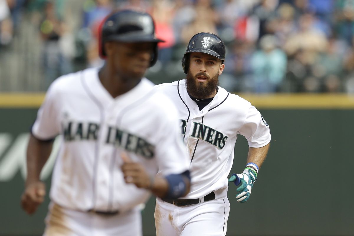 Mariners’ Dustin Ackley rounds the bases behind teammate Austin Jackson after hitting a three-run home run in the fifth. (Associated Press)