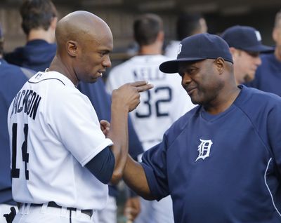 Austin Jackson, left, talks with hitting coach Lloyd McClendon during their days in Detroit. McClendon told the Tigers not to give up on the talented center fielder. (Associated Press)