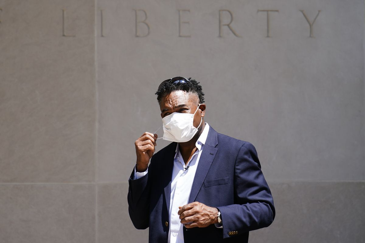 Former NFL player Ken Jenkins exits the building after delivering tens of thousands of petitions demanding equal treatment for everyone involved in the settlement of concussion claims against the NFL, to the federal courthouse in Philadelphia, Friday, May 14, 2021.  (Matt Rourke)