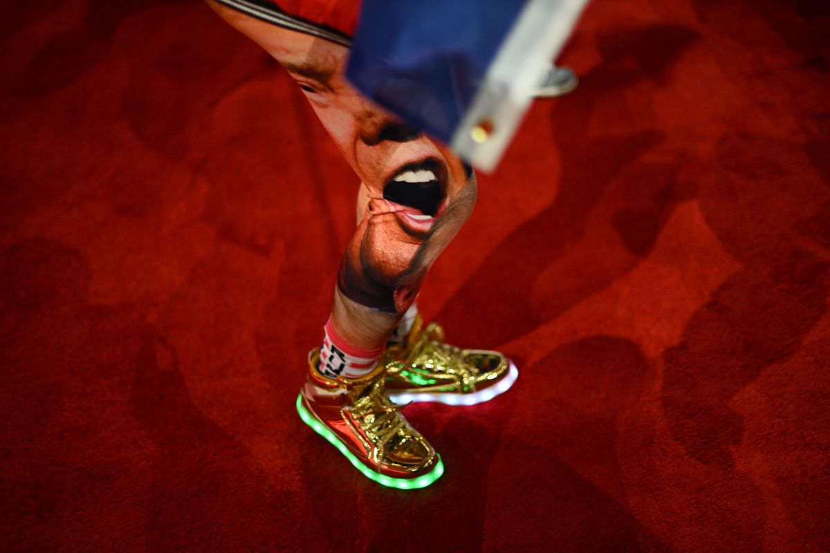 An attendee wears leggings with the likeness of former president Donald Trump during the second day of the RNC convention. MUST CREDIT: Ricky Carioti/The Washington Post  (Ricky Carioti/The Washington Post)