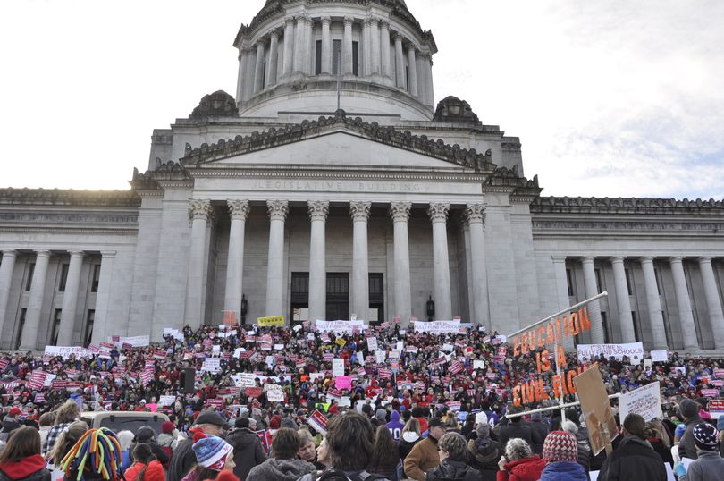 OLYMPIA -- A crowd of demonstrators, estimated by state officials at about 5,500, gather on the steps of the Capitol to demand more money for public schools on 1/16/17. (Jim Camden/The Spokesman-Review)