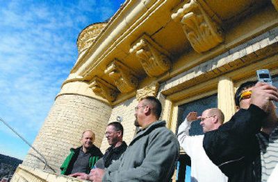 
Ron Oscarson takes a tour group onto the balcony of the Spokane County Courthouse to talk about the flagpole  on Friday. 
 (Photos by Jed Conklin / The Spokesman-Review)