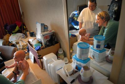 Jan Bostian, right, visits Sarah Parker and her 2-month-old baby Stewart at the Trade Winds Motel in Spokane on Friday.  Through the Nurse Family Partnership program, Bostian and other nurses offer guidance to first-time mothers.  (Brian Plonka / The Spokesman-Review)