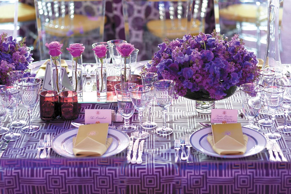 Bryan Rafanelli designed seven state dinners for the Obamas, including the one in honor of David Cameron where White House tables were decorated with purple roses and lilacs and a splash of green. (Genevieve de Manio / A Great Party: Designing the Perfect Celebration)