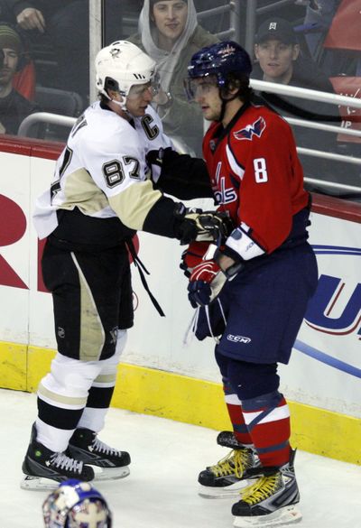Sidney Crosby, left, exchanges words with Alex Ovechkin in first period.  (Associated Press / The Spokesman-Review)